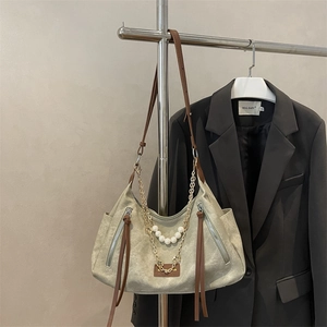 Retro beige canvas hobo bag with brown tassels and elegant pearl chain shoulder strap