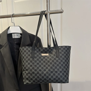 Premium dark grey tote bag with all-over M pattern and golden metal plate for daily commute