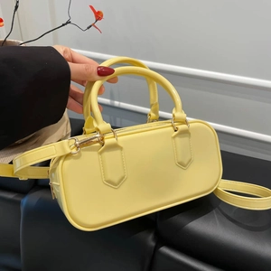 Minimalist lemon yellow leather underarm handbag with gold-tone hardware and crossbody strap