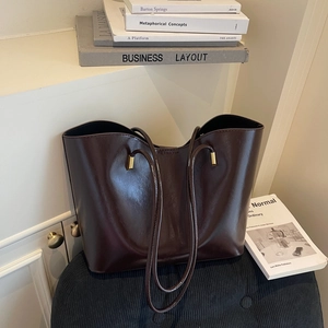 Classic dark brown oil-wax leather tote bag for women with polished gold hardware detail