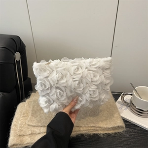 Elegant white 3D floral clutch bag with textured rose petals for formal dinner parties