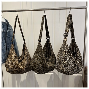Detailed comparison of leopard print canvas crossbody bags with adjustable straps