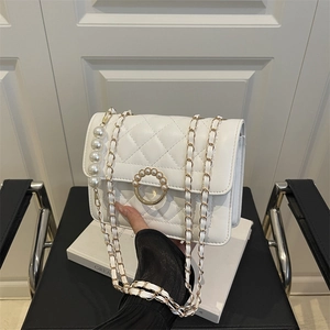 White quilted chain shoulder bag with pearl handle and circular pearl lock clasp