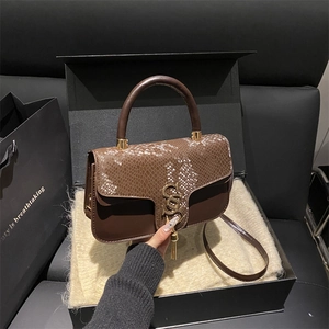 Brown retro crossbody bag with snake pattern flap in a luxury gift box packaging