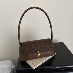 Vintage dark brown leopard print shoulder bag with matte leather finish and gold buckle