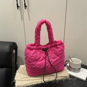 Pink heart quilted puffer tote bag with drawstring closure and spacious design