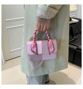 Pink patchwork crossbody bag with decorative silk scarf on handle and shoulder strap