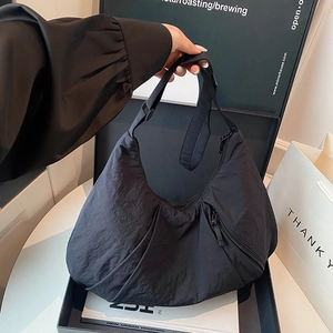 Large capacity black nylon crossbody bag with zipper for casual commuting styles