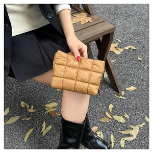 Quilted camel clutch bag with a puffy lattice pattern for a minimalist autumn look