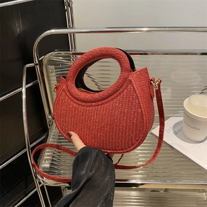 Sparkly red crescent handbag with glitter texture and gold hardware for 2025 winter style