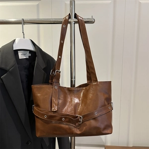 Brown gloss leather tote bag with silver hardware and buckles for daily commuting