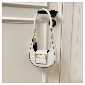 Detailed close-up of white crocodile pattern PU hobo bag with gold metal buckle