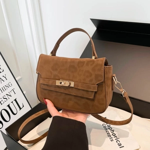 Brown leopard print crossbody handbag with metallic rotating lock and rigid top handle