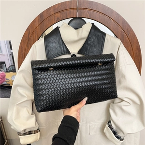 Classic black woven leather clutch bag with minimalist rectangular design for women