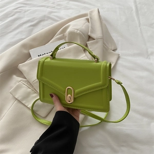 Classic vibrant green crossbody square bag with golden lock and top handle