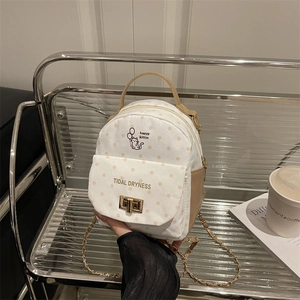 Polka dot mini backpack with cat illustration and chain strap in cream and brown