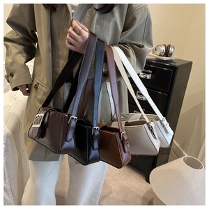 Detailed row of vintage style shoulder bags in coffee, black, brown, beige, and white colors