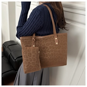 Detail of trendy brown leopard print tote bag set with matching small zipper pouch