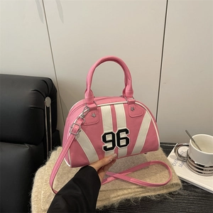 Pink retro sporty bowling handbag with number 96 patch and silver star studs detail