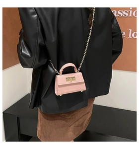 Pink stone pattern mini bag with gold hardware and chain strap shown on a model
