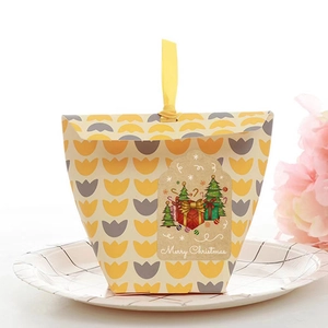 Christmas Kraft paper gift boxes with tulip patterns and festive Merry Christmas stickers