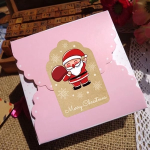 Brown kraft Merry Christmas sticker with Santa Claus on a pink gift box for holiday decor