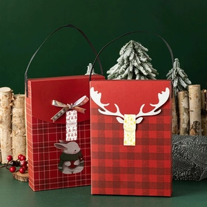 Christmas gift boxes with red plaid, ribbon bow, rabbit print and white antlers decor