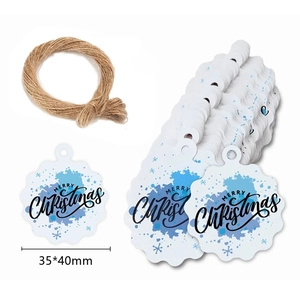 Macro detail of snowflake Merry Christmas gift tags with hemp rope and size dimensions