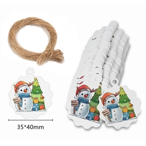 Detail of snowflake Christmas tags with snowman design and natural jute twine