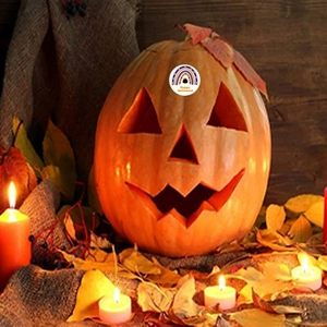 Rainbow Happy Halloween pumpkin decal on carved Jack-o'-lantern with maple leaf and candles