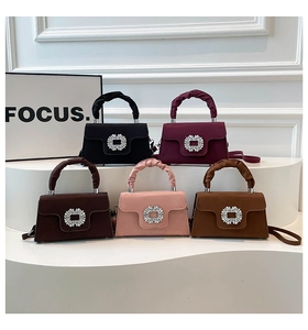 Detailed display of fashionable handbags with rhinestone buckles in five trendy colors