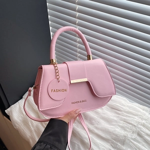 Pink PU leather saddle bag with fashion emblem and golden metallic strap details