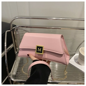 Elegant pink pillow shoulder bag with gold M-logo and chain strap for women