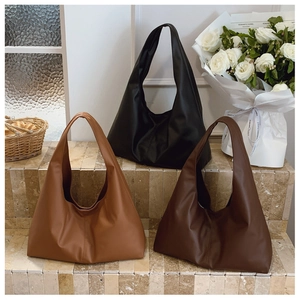 Three minimalist matte PU leather tote bags in caramel, dark brown, and black colors