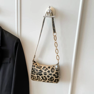 Fashionable leopard print underarm bag with acrylic chain strap and golden hardware