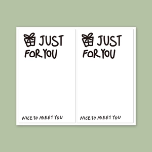 Detail of white rectangular stickers with Just For You text on sage green background