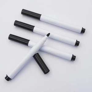 Close-up of four black ink markers with white plastic bodies and durable fiber tips