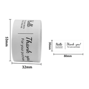 Macro detail of 80x30mm white adhesive thank you labels showing dimensions and roll width
