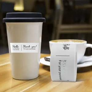 Rectangle white gold foil Thank You sticker applied on a white coffee cup for packaging