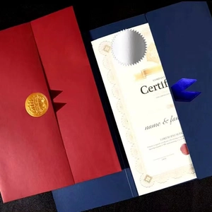 Detail of luxury certificate covers in red and navy blue with gold and silver seals