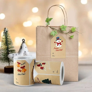 Brown kraft Christmas gift stickers roll featuring snowman and deer with handwrite space