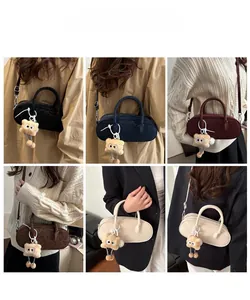 Collection of suede crossbody bags in six colors with plush charms and long shoulder straps
