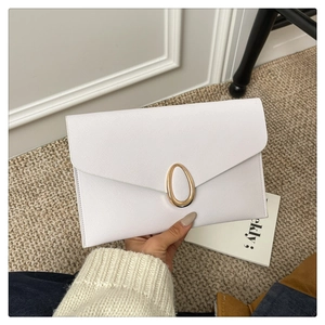 Detail of white Saffiano leather envelope clutch bag with gold oval metal buckle