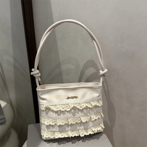 Chic off-white lace shoulder bag with checkerboard pattern and elegant bow details
