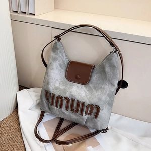 Retro grey canvas and brown leather tote bag for casual commuting with shoulder straps
