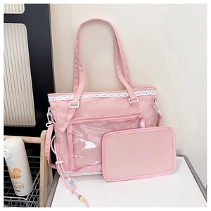 Pink tote bag detail with lace-trimmed clear pocket and matching mesh storage pouch
