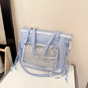 Sky blue canvas ita-bag tote with white lace trim and transparent PVC pocket for badges