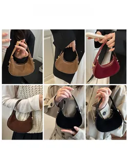 Detailed views of mini suede half-moon handbags in multiple colors and carrying styles