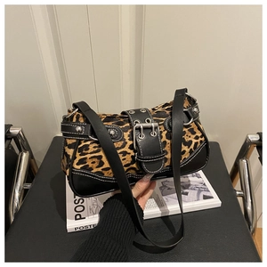 Detail shot of leopard print hobo bag with vintage buckle and silver studs trim