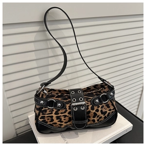 Detail of leopard print shoulder bag with silver buckle and decorative metal rivets